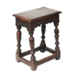An 18th century style oak joint stool, 46cms wide.