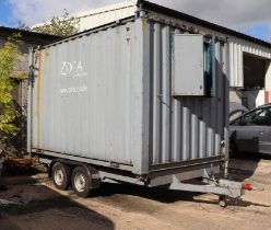 A 12.5ft twin-axle portable site office converted from a shipping container, the single window