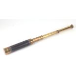 A late Victorian three-draw brass telescope, 74cms long extended, 25.4cms closed.