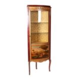 A gilt metal mounted and painted Louis XV style glazed corner display cabinet, 63cms wide.