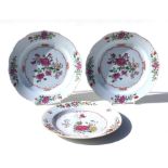 A pair of 18th century Chinese famille rose plates decorated with flowers, 23cms diameter;