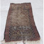 A Persian Balouch hand knotted prayer rug with geometric design, on a beige ground, 154 by 86cms.