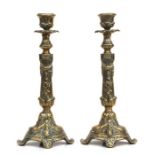 A pair of heavy cast brass candlesticks, 27cms high (2).
