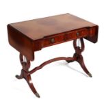 A Regency style crossbanded mahogany sofa table with two frieze drawers and lyre supports, on