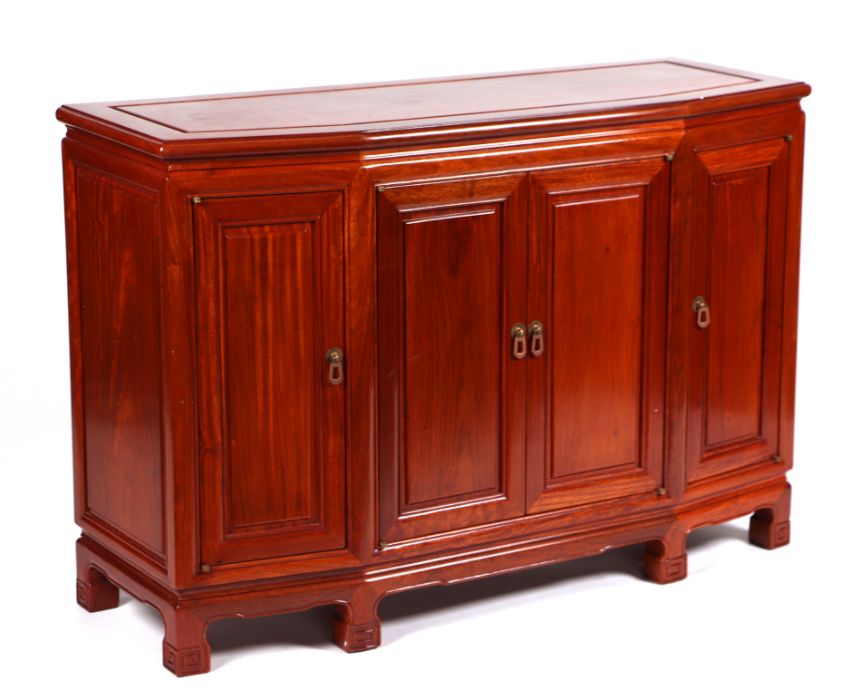 A Chinese hardwood sideboard with four cupboard doors, 112cms wide.