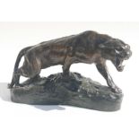 Thomas Francois Cartier (French 1879-1943) a bronze study of a snarling tiger, on a naturalistic