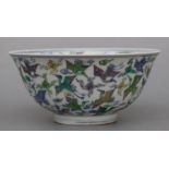 A Chinese Ducai footed bowl decorated with birds amongst clouds, six character blue mark to the