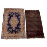 A Persian Kerman rug with central floral design within borders, 184 x 123cm; together with a Persian