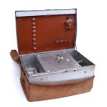 An early 20th century aluminium four-person picnic trunk with partial fitted interior including a