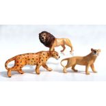 A Beswick lion and lioness; together with a leopard, all gloss (3).