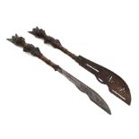 A pair of Benin bronze style knives with figural handles, each 46cms long (2).