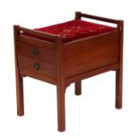 An Edwardian mahogany piano stool, the two drawers with drop-down fronts for sheet music, 52cms