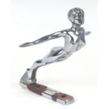 An accessory chrome plated car mascot in the form of diving lady speed nymph, 18cms long.