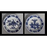 A pair of Chinese blue & white plates decorated with precious objects, 21cms diameter (2).