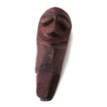 A Vanuatu / New Hebrides tribal carved wooden head with old hand written collection number '121',