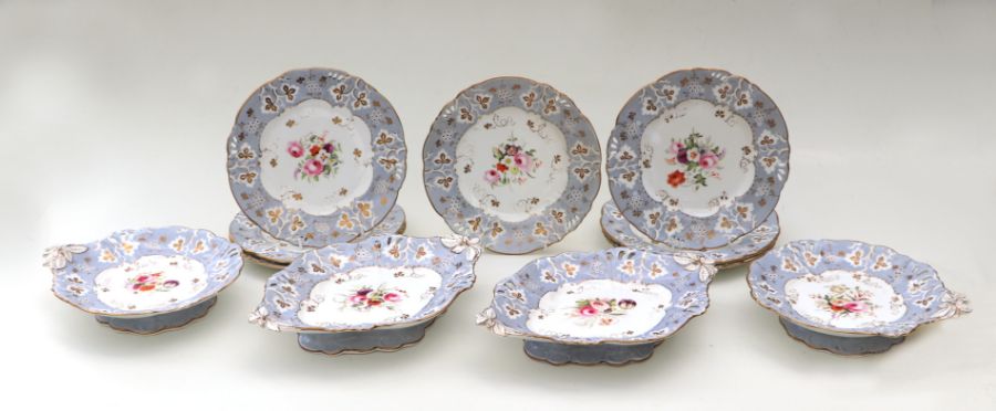 A 19th century dessert set decorated with flowers and gilt highlights, on a pale blue ground;