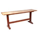 A Heals Arts & Crafts oak refectory or serving table, the rectangular top on trestle end supports