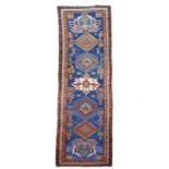 An early 20th century North West Persian runner, 95 by 334cms.