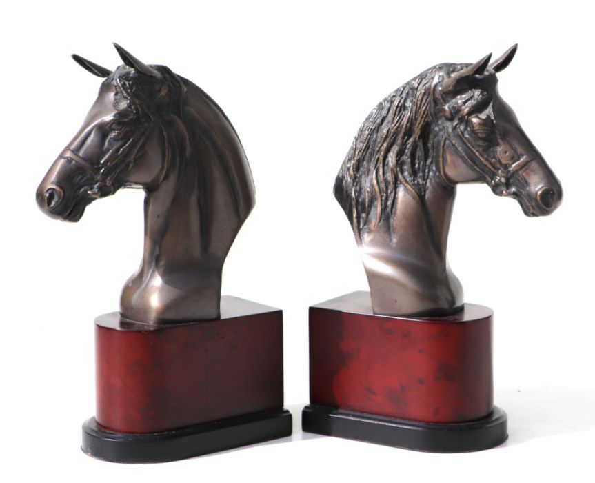 A pair of patinated bronzed horse bust study bookends, 30cms high.