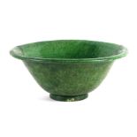 A large Chinese monochrome green glazed footed bowl (restored), 38cms wide.