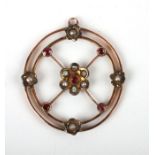 An Edwardian 9ct gold ruby and seed pearl set pendant.