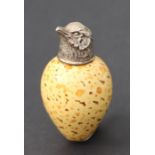 A MacIntyre & Co. bird's egg scent bottle with white metal screw cover modelled as a chicks head,
