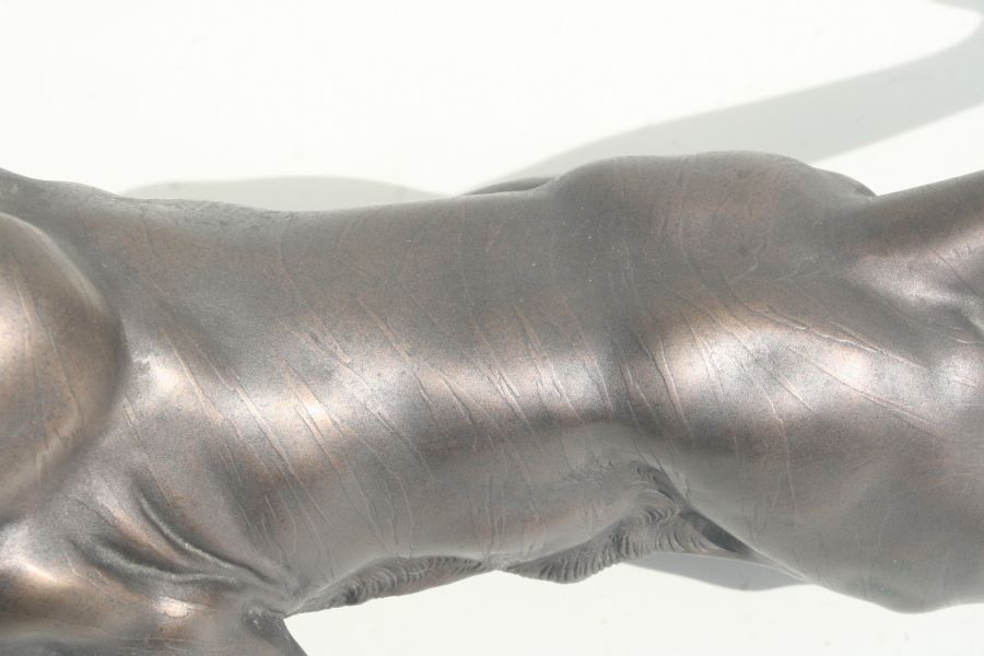 A large bronzed resin study of a snarling tiger, 63cms long. - Image 3 of 3