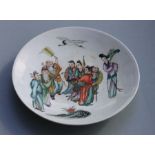 A Chinese famille rose shallow footed dish decorated with figures, 36cm diameter.Condition