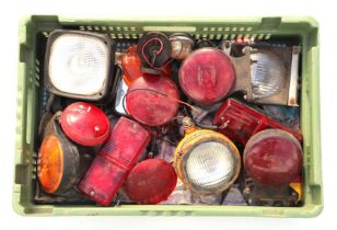 A selection of Lucas and other tractor rear and head lights to include rubber surround examples.
