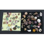 A quantity of costume brooches to include cabochon, enamel and hardstone examples.