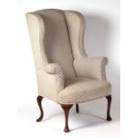 A George II upholstered wingback armchair with cabriole front legs.Condition ReportThe chair is