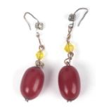 A pair of cherry amber Bakelite bead drop earrings.