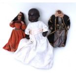An early 20th century black composite doll; together with two Middle Eastern wired textile dolls (