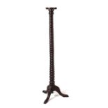 A large oak pricket candle stand / torchere with bobbin turned column, on tripod base, 138cms high.