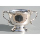 A George V two-handled trophy cup, Birmingham 1926 and maker's mark for William Hutton & Sons, 11cms