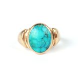 A 9ct gold ring set with an oval turquoise cabochon, approx UK size 'L', 6.2g.Condition ReportDate