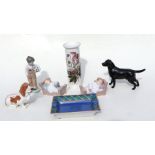 A Beswick figure of a black Labrador; together with a Royal Copenhagen figure of a Bassett hound;