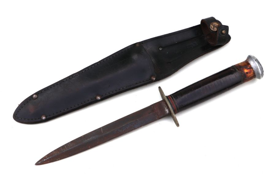 A WWII Commando knife stamped Milbro Kampa & Sheffield England on both sides of the ricasso, in