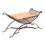 A wrought iron 'X' frame stool with solid pine seat, 88cms wide.