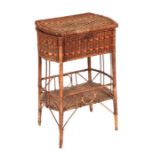 An Edwardian wicker work two-tier sewing box occasional table, 47cms wide.