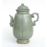A large Chinese celadon glaze wine ewer. (possibly Ming) 30cm high