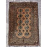 A Persian rug with repeating guls on a brown ground within a multi border, 204 by 130cms.Condition