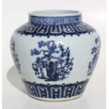 A Chinese blue and white vase decorated pine trees and flowers, 21cm high