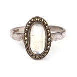 A silver marcasite and moonstone ring, approx UK size 'N'.