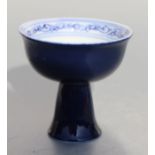 A Chinese blue & white stem cup decorated with flowers, six character blue mark to the underside,