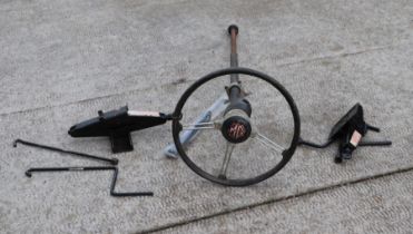 An MG six-spoke 15ins diamater steering wheel and steering column, possibly from an MG Midget;