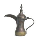 A Persian / Islamic copper and brass Dallah with toucan spout and impressed decoration, 27cms high.