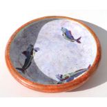 A pottery lustre bowl decorated with fish, 34cms diameter.