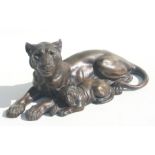A bronzed spelter group depicting a lioness and her cub, 35cms long.