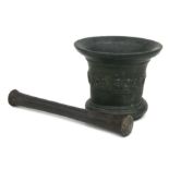 A large cast bronze mortar and pestle, probably 18th century, 15cms high.Condition ReportThe